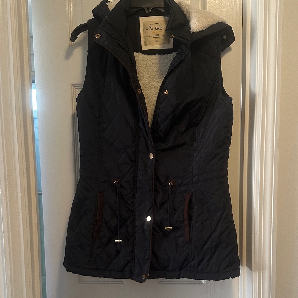 Women's Quilted Navy blue Vest with soft lining and a hood. Pockets.